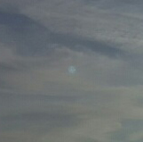 Blue orb moves in the sky closeup